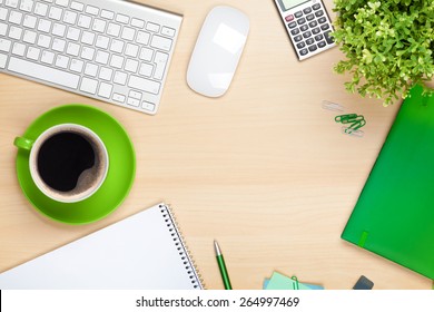 Office Table With Coffee Cup, Computer And Flower. View From Above With Copy Space