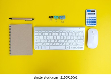 Office table desk, flat lay, top view On the desk background, there is a blank laptop, office supplies, a pencil, and a coffee cup. Conecpts for business and educationOffice table desk, flat lay, top 