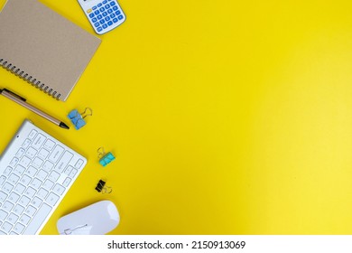 Office table desk, flat lay, top view On the desk background, there is a blank laptop, office supplies, a pencil, and a coffee cup. Conecpts for business and educationOffice table desk, flat lay, top 