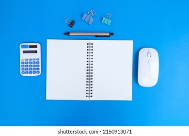 Office table desk, flat lay, top view On the desk background, there is a blank laptop, office supplies, a pencil, and a coffee cup. Conecpts for business and educationOffice table desk, flat lay, top 