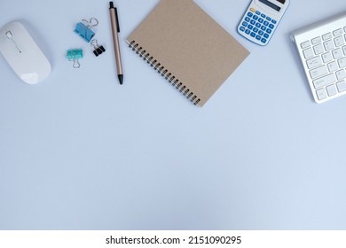 Office table desk, flat lay, top view On the desk background, there is a blank laptop, office supplies, a pencil, and a coffee cup. Conecpts for business and educationOffice table desk, flat lay, top 