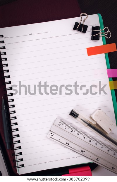 Office table desk or school supplies on table.
School and office tools on office table. Desk with notebook or
paper note and stationery object on office desk. Office desk
concept. Math supplies.