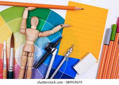 Office table desk with set of tools for creative art work on a white background.