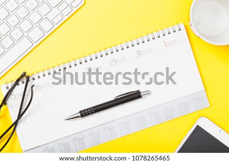 Similar – Calendar with pen and glasses on yellow background