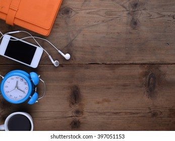 office table with notebook, computer keyboard, mouse, cup of coffee, tablet pc and smartphone. copy space