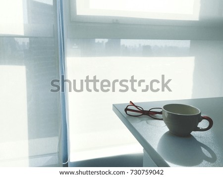office table with notebook put a pen and glasses in modern office With coputer notebook