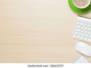 Office Table With Notepad, Computer And Coffee Cup. View From Above With Copy Space