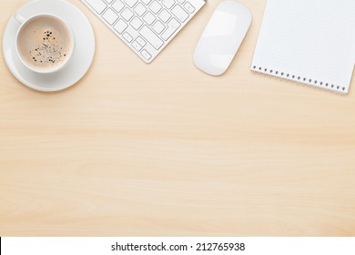 Office Table With Notepad, Computer And Coffee Cup. View From Above With Copy Space