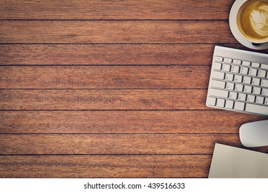 Office table with notepad, computer and coffee cup and computer mouse. View from above with copy space