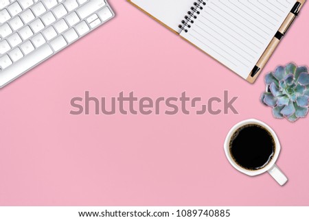 Office table with notepad and computer keyboard and other office supplies. Top view with copy space, flat lay.