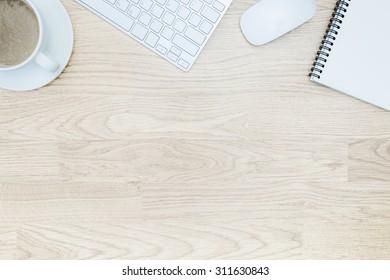 Office table with notepad, mouse,keyboard , coffee cup. View from above with bottom copy space / clean desk from top - Shutterstock ID 311630843