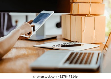 office at table and using smartphone. 