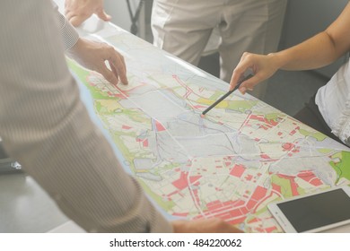 Office.  Teamwork in the field of project development, building construction and urban development. Architects. Professionals. People at work.