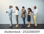 Office, technology and row of business people for hiring, recruitment or patience for corporate career. Diversity, men and women as candidates with smartphone, document or waiting queue for interview