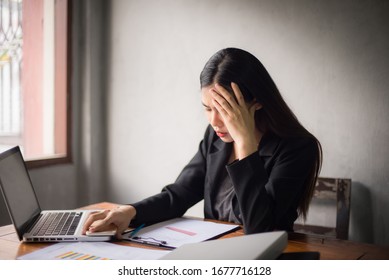 Office time, Asian young woman working in office With stress and business communication through mobile phones, executives, business women - Shutterstock ID 1677716128