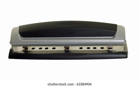 Office Tool Called A Three Hole Punch Isolated On A White Background. This Is Used In An Office For Punching Holes In Paper In Order To Place Them In A Three Ring Binder