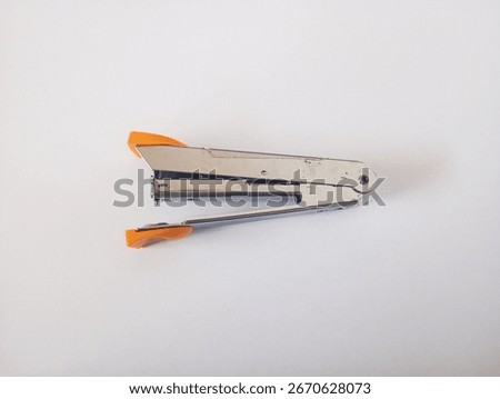 office tool stapler and white background 