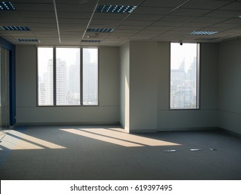 Office windows, empty work space with building view