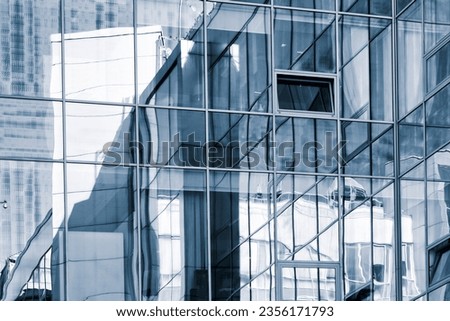 Similar – mirrored facade of an office building