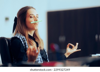 
				Office Woman Balancing a Pen Under her Nose in Breathing Exercise. Businesswoman trying to relax in need to unwind from work
				