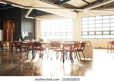 The Office Wont Work Unless We Do. Shot Of A Table And Chairs In An Open Plan Office With No People.