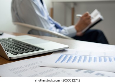 Office work concept an office worker using an idea to summarize information and creating a mind mapping writing on the paper.