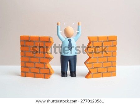 An office worker breaks down a wall to achieve a breakthrough. Innovation and progress overcome bureaucracy. Change management drives efficiency and new opportunities in business.
