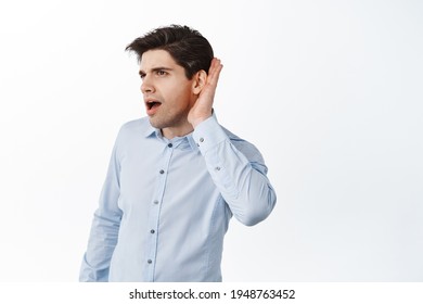 Office Worker Eavesdropping, Holding Hand Near Ear And Listen Closer, Overhear Rumors At Work, Standing Against White Background