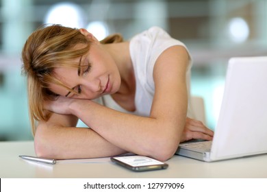 Office worker falling asleep during working hours