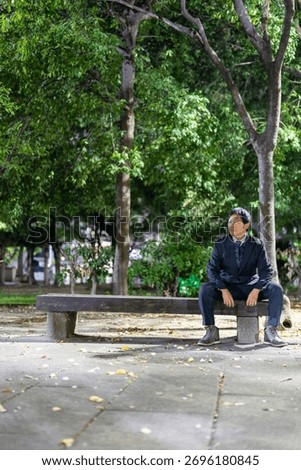 Office Worker Finding Resolve on a Park Bench at Night