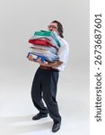 Office worker holding huge stack of binders and documents, being completely buried and overwhelmed by endless paperwork. Concept of bureaucracy, tasks, deadlines, overworking