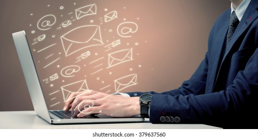 An Office Worker Sending Emails And Communication With Clients With The Help Of A Portable Laptop On Desk Concept