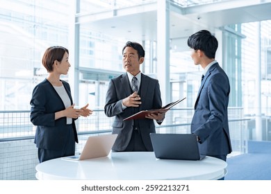 Office worker standing in front of a computer
