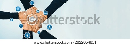 Office worker team stacking hand together symbolize successful group of business partnership and strong collective unity teamwork in community workplace in panoramic banner. Shrewd Amity