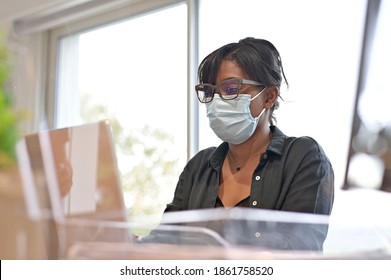 Office Worker Wearing Surgical Face Mask In Open Space Area