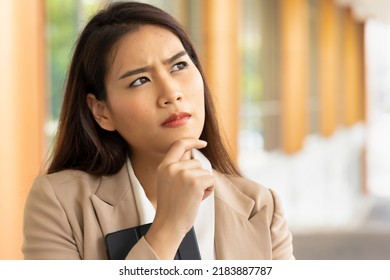 Office worker woman thinking, planning with stress, overworked office syndrome concept