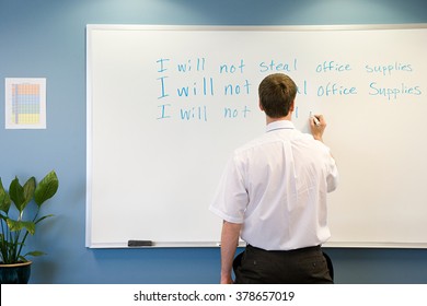 Office worker writing on whiteboard