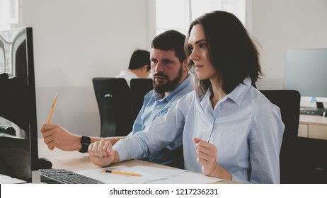 Office workers communicating together and discussing a project on a computer screen - Shutterstock ID 1217236231