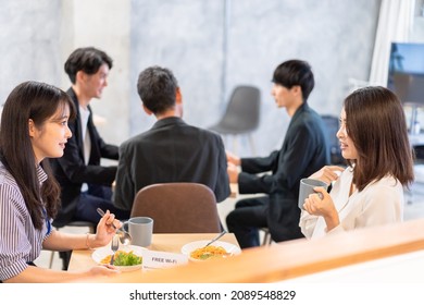 Office workers having lunch at a company cafeteria - Powered by Shutterstock