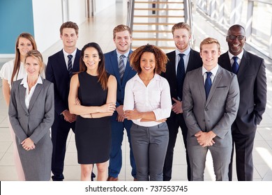 Office workers in a modern lobby, group portrait