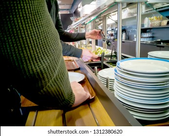 Office Workers Pick Food In Dining Room With  Empty Tray. Close Up Of Plates, Dishes. Inside Taking A Lunch Break, Eating And Drinking Concept  Food Center. Lunch Time, Hurry Up For Food Queue.