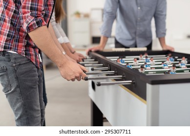 Office Workers Playing An Indoor Soccer World Cup Game During Their Break Time To Relieve Stress.