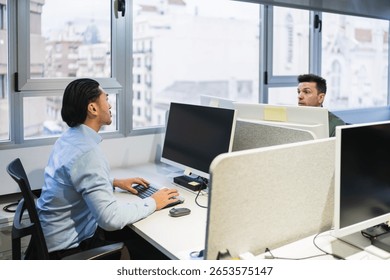 Office workers using computers in a bright coworking space, collaborating and focusing on their tasks - Powered by Shutterstock - Get 15% off with code: PIKWIZARD15