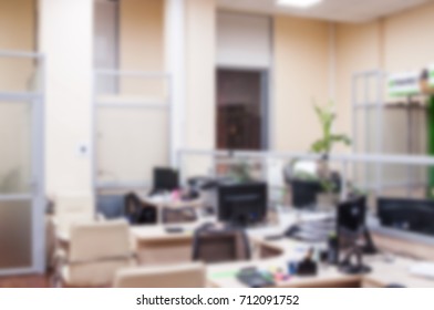 Office workers at work. The interior of working office space. Blurred background for design
