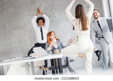 Office workers workout during coffee break.They try to practice yoga to relax after stressed day. - Powered by Shutterstock