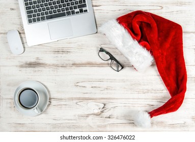 Office Workplace with Keyboard Laptop Computer, Coffee and Christmas Decoration. Business Holidays Concept - Powered by Shutterstock