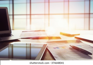 Office workplace with laptop on wood table against the windows. - Powered by Shutterstock