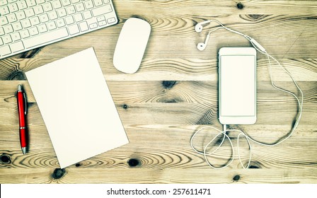 Office Workstation With Keyboard, Phone, Headphones, Paper And Pen. Retro Style Toned Mock Up 