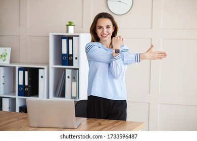 Office Young Woman Is Doing Fitness Exercise At Workplace. Happy Business Lady Warm-up Her Body. Business, Healthy Lifestyle Project.