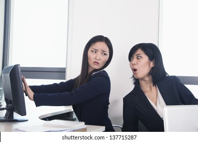 Officer Worker Hiding Her Computer From Coworker